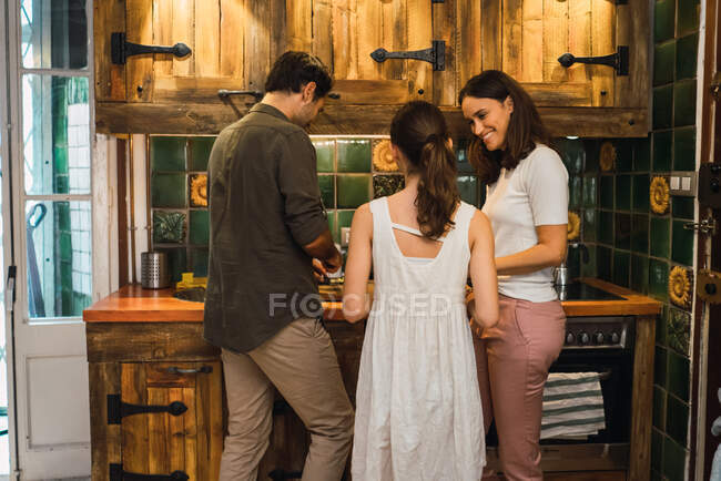 Content family cooking together — Stock Photo