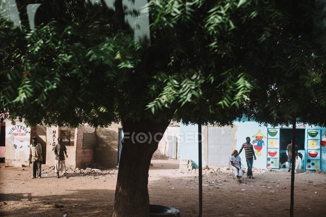 Goree, Senegal- December 6, 2017: View to people on street of city in tropics. — Stock Photo