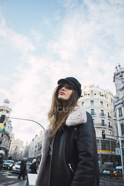 High angle portrait of brunette woman posing on street scene — Stock Photo