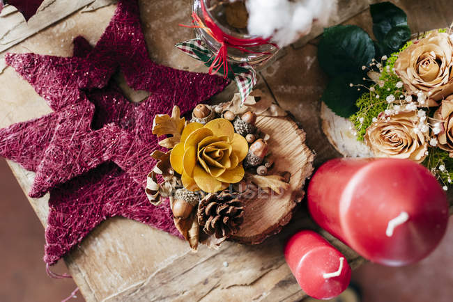 Directly above view of decorations on wooden table — Stock Photo