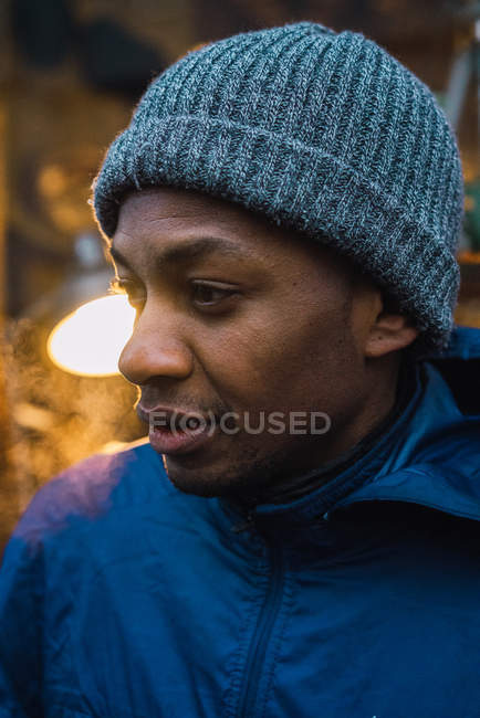 Close up portrait of black man in knitted hat — Stock Photo