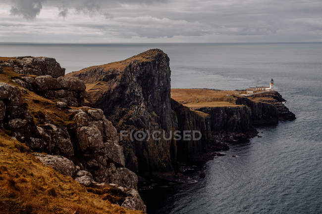 Distant view of beacon on coastal hill — Stock Photo
