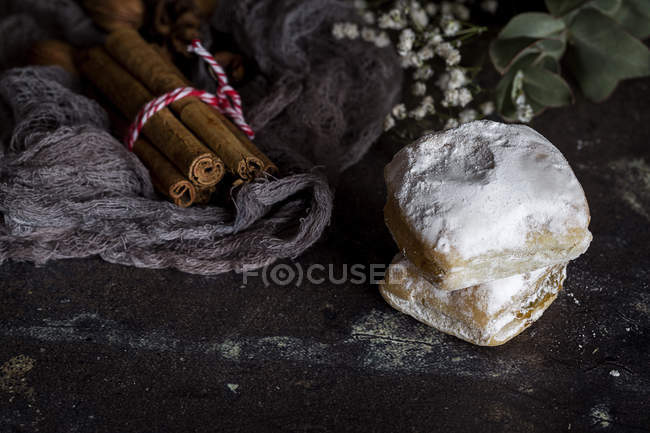 Still life of typical spanish biscuits and cinnamon — Stock Photo