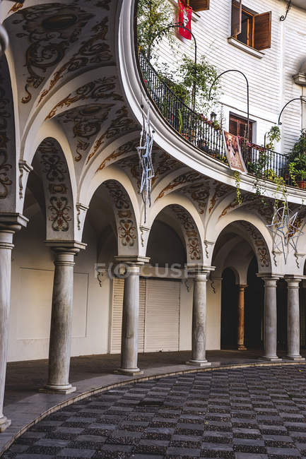 Exterior of ornate passage with columns — Stock Photo