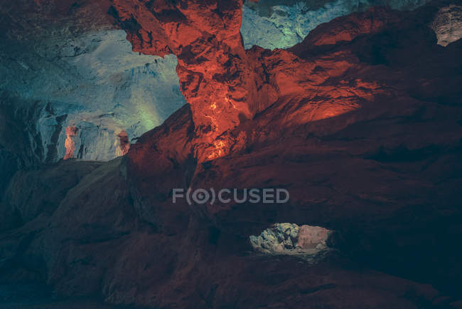 Scenic view of illuminated ways and passages in natural cave. — Stock Photo