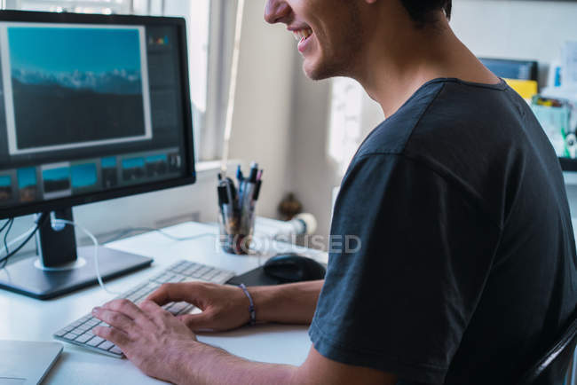 Crop freelance worker at computer at home — Stock Photo