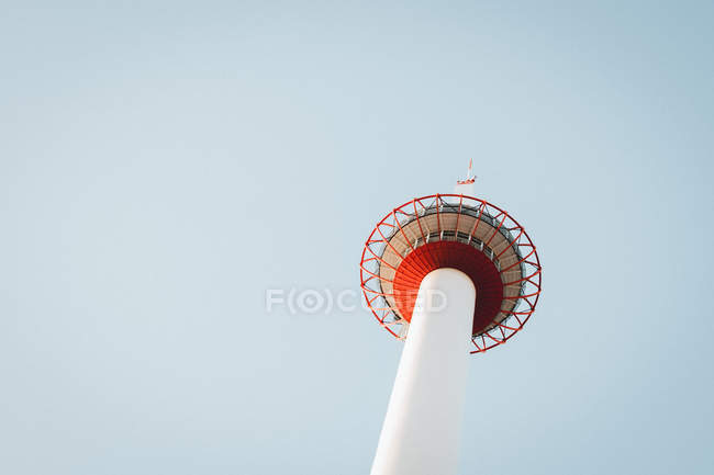 Bottom view of big tower landmark over blue sky — Stock Photo