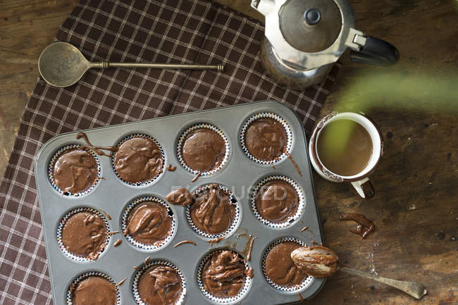 Directly above view of raw chocolate muffins prepared for baking — Stock Photo