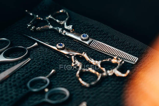 Set of ornate professional barber scissors — Stock Photo