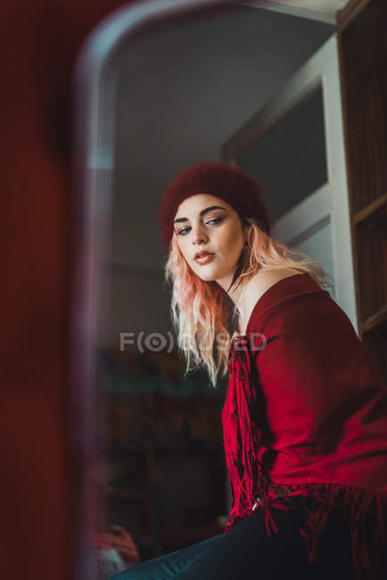 Portrait of woman with pink hair in red clothing — Stock Photo
