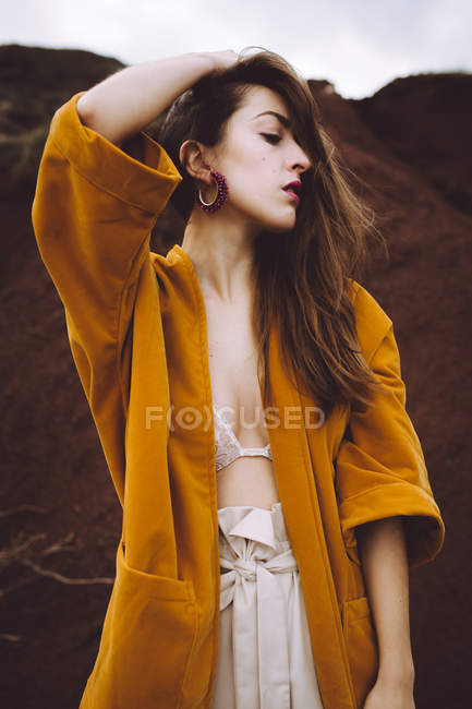 Brunette girl posing in jacket at nature — Stock Photo