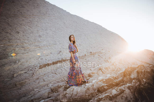 Tender brunette posing on rocky terrain — Stock Photo