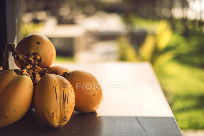 Cropped image of exotic fruit on table — Stock Photo