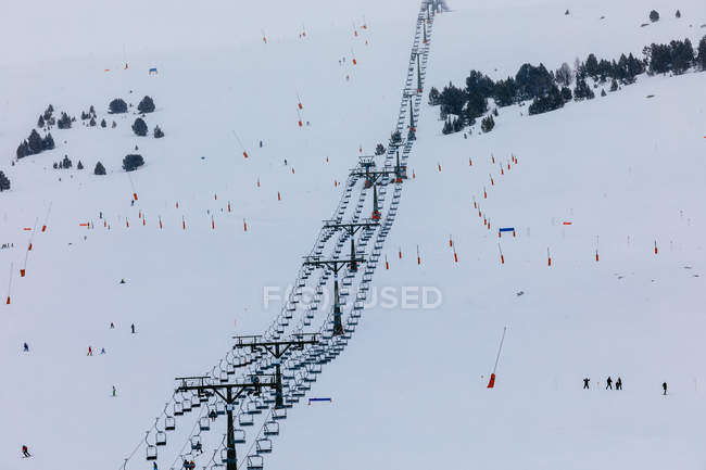 Distant view of ski elevator on mountain slope — Stock Photo