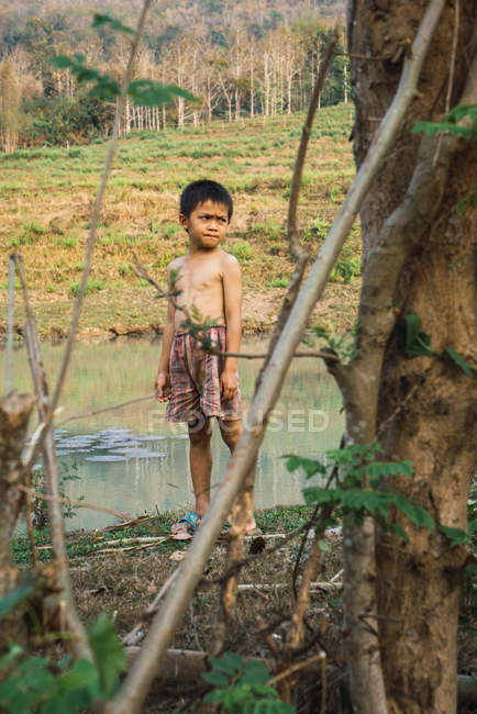 LAOS- FEBRUARY 18, 2018: Thoughtful local boy in nature — Stock Photo
