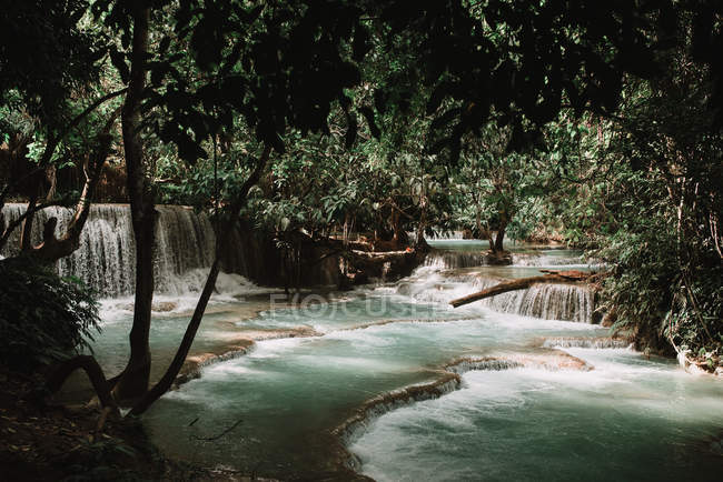 Scenic view to waterfall cascade in tropical forest — Stock Photo
