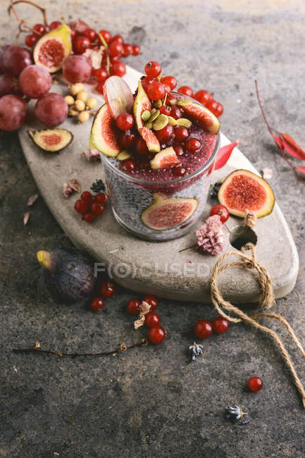 Glass of chia smoothie with coconut milk on stone board — Stock Photo