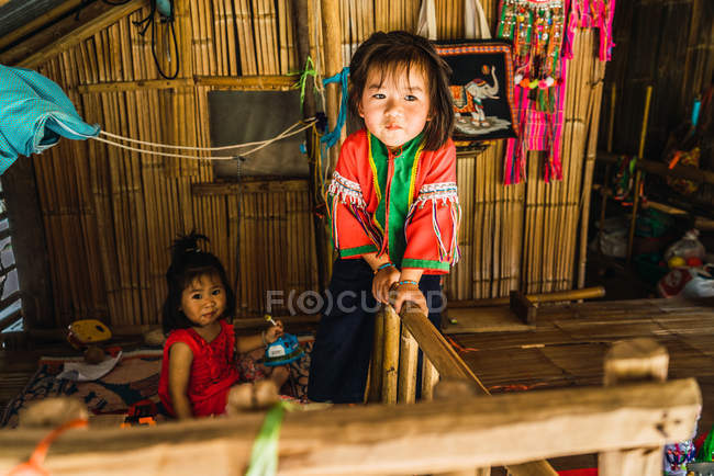 CHIANG RAI, THAILAND- FEBRUARY 12, 2018: Cute children sitting at home — Stock Photo