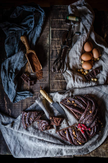 From above sweet rustic chocolate cake on wooden table. — Stock Photo