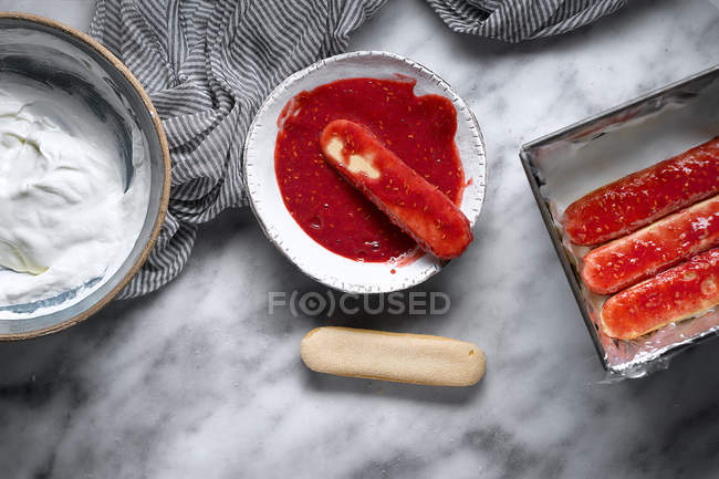 From above icing in raspberry syrup biscuits — Stock Photo