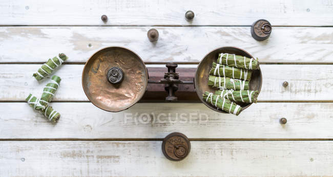 Pair of scales with spices — Stock Photo