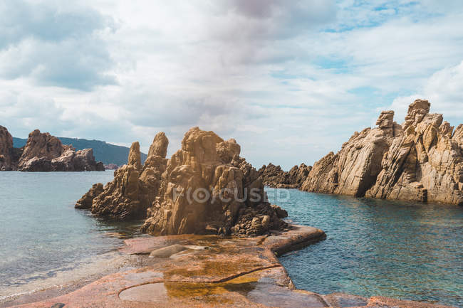 Coastal rocks and embankment — Stock Photo