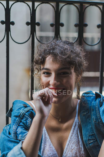 Laughing curly woman with red lips — Stock Photo