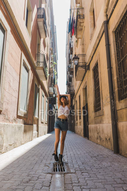 Woman standing on street — Stock Photo