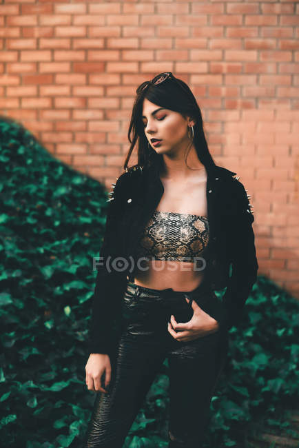 Woman in crop top and leather pants — Stock Photo