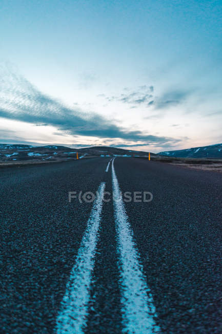 Countryside road towards hills — Stock Photo