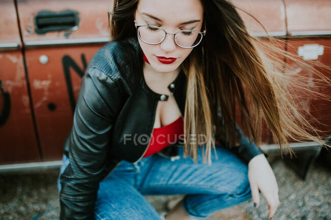 Stylish woman posing near car — Stock Photo