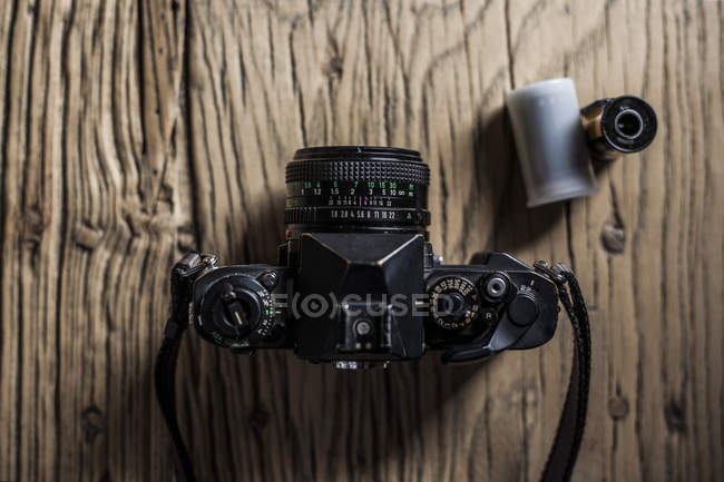 Analog camera on wooden table — Stock Photo
