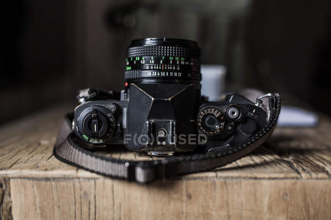 Analog camera on wooden table — Stock Photo