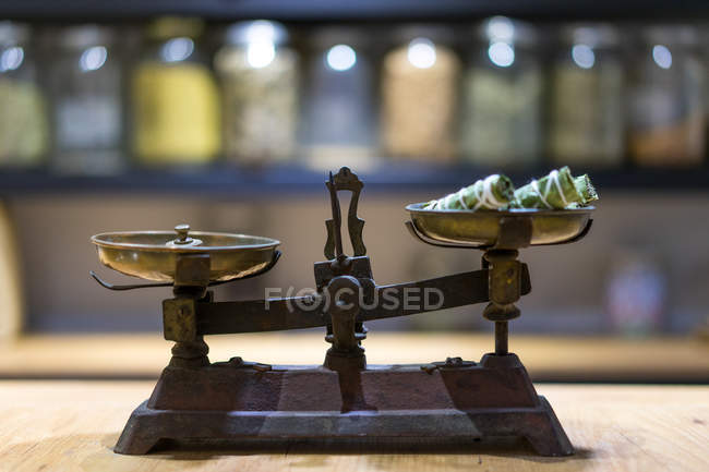 Pair of old scales with spices — Stock Photo