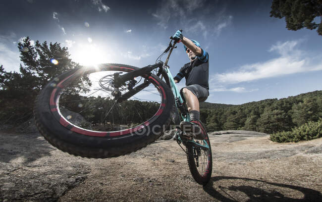 Rider in action. biker performing a manual — Stock Photo