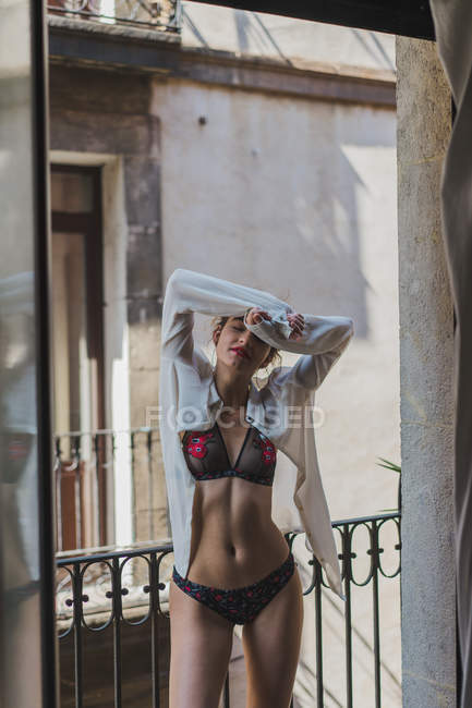 Tender girl in lingerie on terrace — Stock Photo