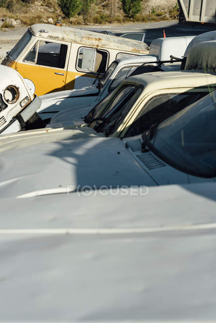 Wrecked old grungy cars on the dump in a pile. — Stock Photo