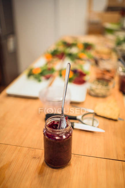 Jar with jam and fork — Stock Photo