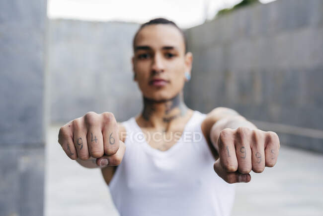 Crop male hands with tattoos on fingers designating events — Stock Photo