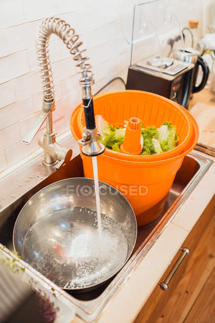 Green lettuce prepared for washing — Stock Photo