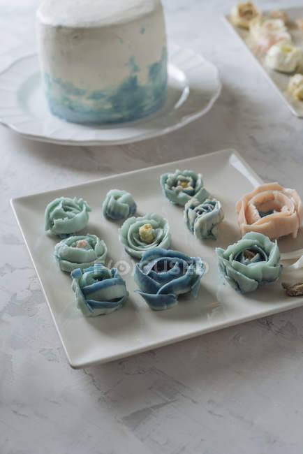 Blue and beige buttercream flowers — Stock Photo