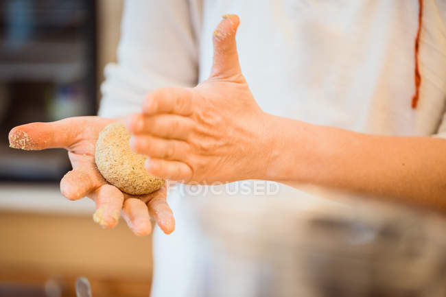 Cook making patty with crumbs — Stock Photo