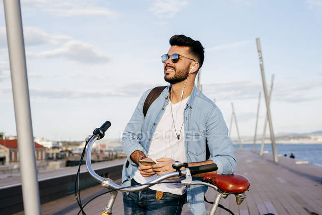 Guy standing on waterfront — Stock Photo