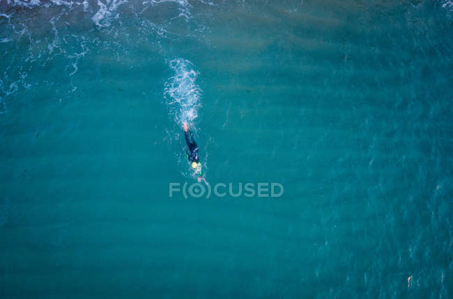 Triathlete training in sea water — Stock Photo