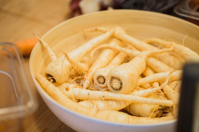 Fresh parsnips in bowl — Stock Photo