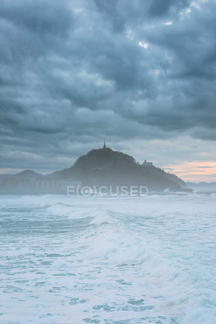 White stormy waves and breakwater — Stock Photo