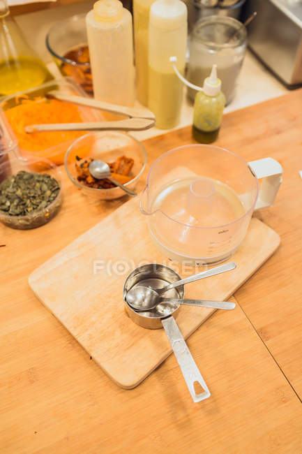 Utensils on kitchen table — Stock Photo