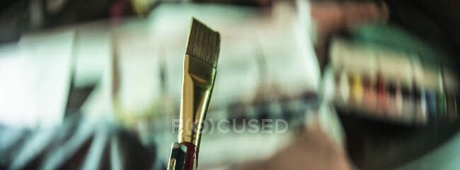 Close-up professional brush at the table with drawing equipment indoors. — Stock Photo