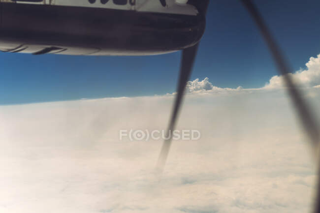 Clouds and land view from airscrew airplane — Stock Photo