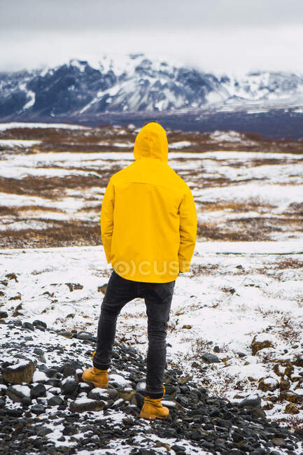 Anonymous person in snowy valley — Stock Photo
